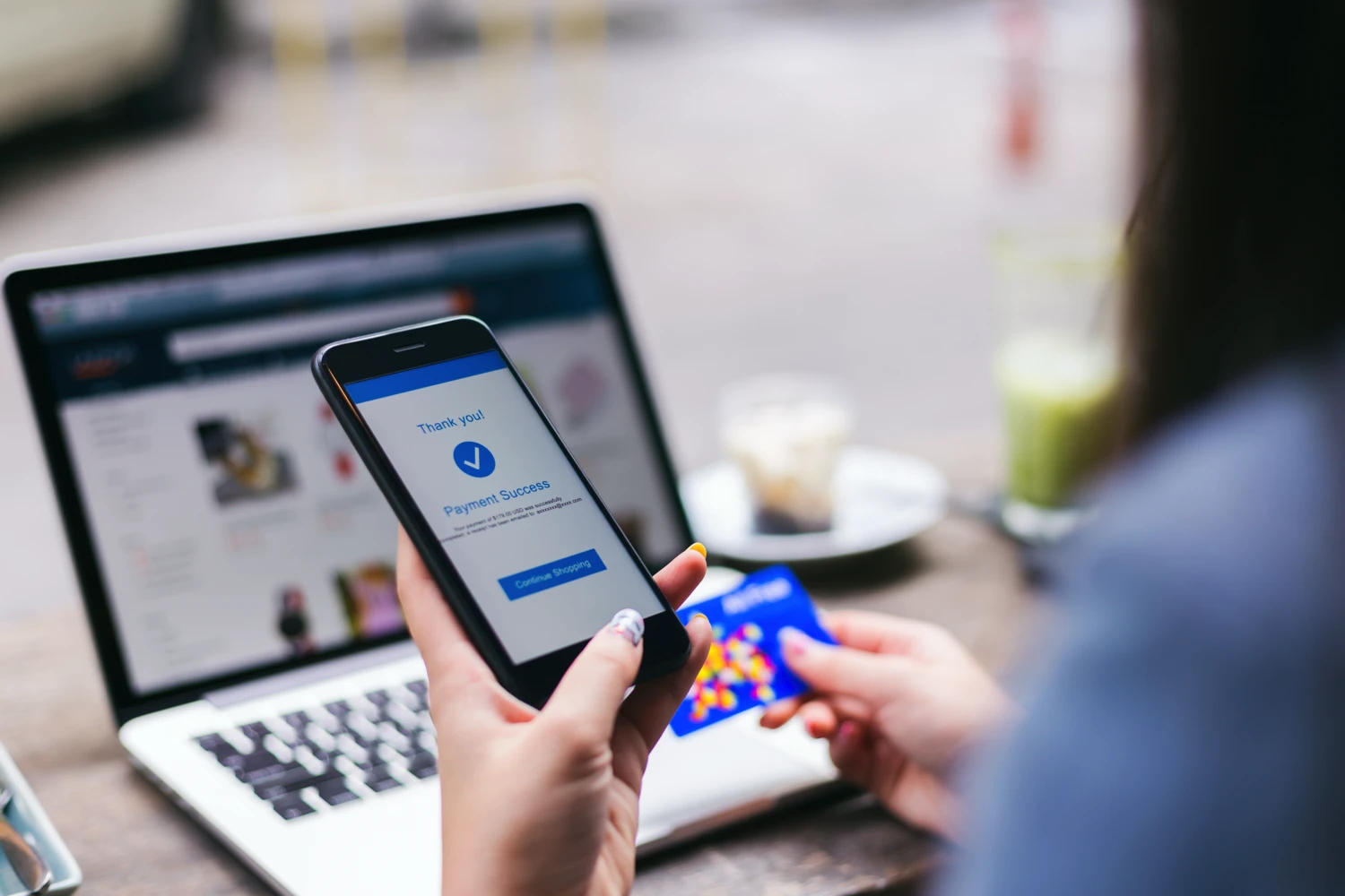 Woman using credit card while shopping on online